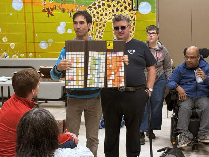 Five Counties Children's Centre staff have been taking part in the Time in My Shoes program, offered by the Peterborough Council for Persons with Disabilities. The program's aim is to help participants explore accessibility and inclusion through discussion and hands-on experience. At a recent session, program facilitator Jordie (also a former Five Counties client) shared a bliss (or communication) board that he used as a child to express his words, thoughts, and likes. Whether spoken, written, or shared visually as symbols, words have the power to inform and inspire and do injury if not used properly. (Photo: Five Counties Children's Centre)