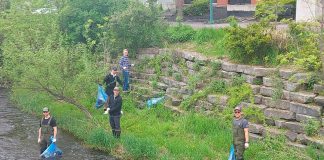 Donning hip waders and safety gear, staff from Engage Engineering collect garbage in and along the creek beside their downtown Peterborough office every spring, and plant native species along the banks of the creek. The efforts of the business are bringing wildlife back to the area. Pictured are Steven Dingman, Dominik Jedrzejewski, Logan Mattern, and Joshua Burke. (Photo courtesy of Engage Engineering)