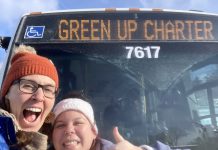 GreenUP education program coordinator Melanie Ellison and education and active transportation program manager Ashley Burnie Seeds in front of the Peterborough Transit bus that served as a classroom for Grade 7 and 8 students from St. Paul Catholic Elementary School in Lakefield on February 12, 2026. The students experienced hands-on education to familiarize them with riding transit safely and with confidence. (Photo: Melanie Ellison / GreenUP)