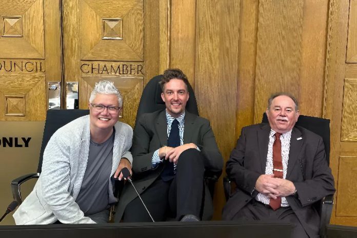 Town Ward councillors Joy Lachica and Alex Bierk with Ashburnham Ward councillor Keith Riel in council chambers on September 3, 2025. The three councillors have often voted together on social issues affecting the city. (Photo courtesy of Alex Bierk)