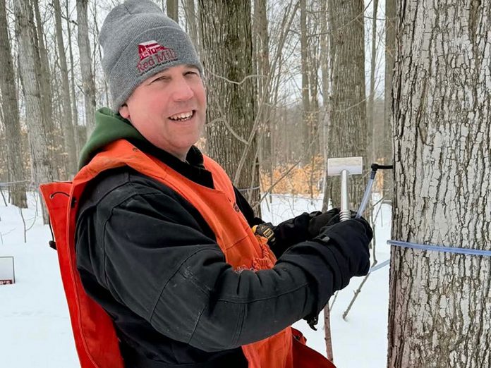 Sebastien Poulin of Red Mill Maple Syrup taps a tree on his and his wife Julie Vallieres's 100-acre property in Millbrook. Vallieres says the couple has "maple syrup in our blood" having been raised on sugar shacks in Beauce, Quebec, a region well-known for producing maple syrup. Poulin's grandfather Victor started making maple syrup at age 15 to help support his family in the small town of St-Victor, Quebec. (Photo: Red Mill Maple Syrup)