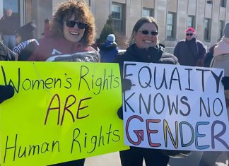 KWIC, KSAC, and YWCA Peterborough Haliburton team up to fight for justice this International Women’s Day Participants of the 2025 International Women's Day rally outside Peterborough City Hall organized by Kawartha Sexual Assault Centre (KSAC) and Kawartha World Issues Centre (KWIC) and supported by the Peterborough Public Library. The YWCA Peterborough Haliburton is also partnering with the organizations for the 2026 event on Saturday, March 7, which includes a rally and march to a community event at the library featuring music, food, a keynote, and conversations. The event aligns with this year's United Nations' International Women's Day 2026 theme of "Rights. Justice. Action. For ALL Women and Girls." (Photo courtesy of KSAC/KWIC)