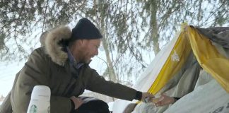 Chris Vyn, former outreach worker with One City Peterborough, provides food and supplies to a woman experiencing homelessness in 2022. (kawarthaNOW screenshot of One City Peterborough video)