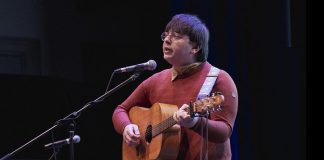 Tristan Konkle is the Peterborough Folk Festival’s 2026 Emerging Artist Tristan Konkle performs his song "Killing Time" at the Peterborough Folk Festival's Emerging Artist Award announcement at Market Hall Performing Arts Centre in downtown Peterborough on March 12, 2026. As the winner of the 2026 award, Konkle will be given showcase performance spots at the Peterborough Folk Festival in August and will receive a trip to the Folk Music Ontario Conference, the $1,000 PMBA Lynn Morris Memorial Award, and recording and production of a single courtesy of Electric Alchemy Recording Studio. (Photo: Luke Best)
