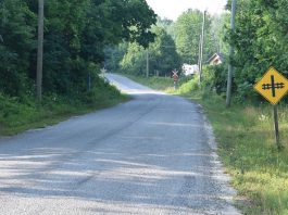 The southbound approach to the CPKC Hunt Road grade crossing in the Township of Cramahe where a 69-year-old Frankford man was killed on July 14, 2025 after his pickup truck was struck by a westbound Canadian Pacific Kansas City freight train. This photo was taken on July 16, 2025 in environmental conditions similar to those at the time of the collision. (Photo: Transportation Safety Board of Canada)