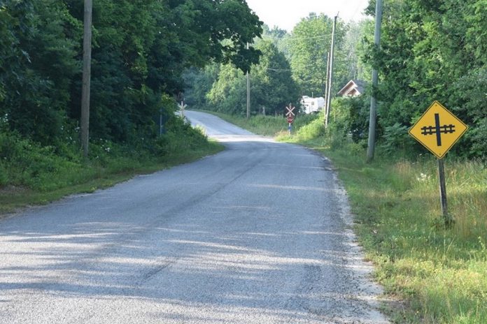 The southbound approach to the CPKC Hunt Road grade crossing in the Township of Cramahe where a 69-year-old Frankford man was killed on July 14, 2025 after his pickup truck was struck by a westbound Canadian Pacific Kansas City freight train. This photo was taken on July 16, 2025 in environmental conditions similar to those at the time of the collision. (Photo: Transportation Safety Board of Canada)