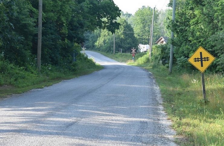 The southbound approach to the CPKC Hunt Road grade crossing in the Township of Cramahe where a 69-year-old Frankford man was killed on July 14, 2025 after his pickup truck was struck by a westbound Canadian Pacific Kansas City freight train. This photo was taken on July 16, 2025 in environmental conditions similar to those at the time of the collision. (Photo: Transportation Safety Board of Canada)