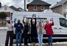 United Way Peterborough & District campaign officer Adeline Murphy, Kawartha Food Share warehouse coordinator Sunday Abdodunrin, Kawartha Food Share general manager Ashlee Aitken, United Way community impact officer Elisha Rubacha, United Way data/finance officer Joy Uson, and Peterborough & District Labour Council recording secretary Trish Bucholtz pose in front of the Kawartha Food Share van packed with menstrual hygiene products for those in need during the wrap-up event on March 16, 2026 for the 10th annual Period Promise campaign. (Photo courtesy of United Way Peterborough & District)