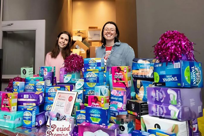 United Way Peterborough & District campaign officers Elyse Belsey and Adeline Murphy collecting menstrual hygiene products for those in need during the Period Promise drive at The Tiffany Show's International Women's Day Party on March 8, 2026. A total of 41,556 products valued at $20,725 were collected during the 10th annual campaign. (Photo courtesy of United Way Peterborough & District)