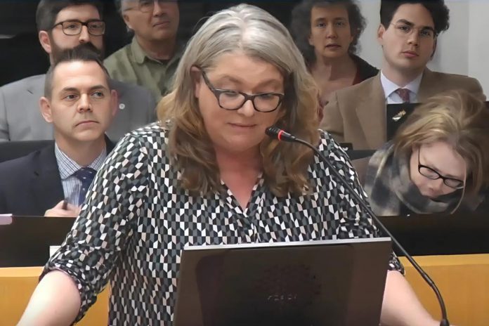 Jennifer Lacey, a tenant at 700 Parkhill Road West in Peterborough, during her delegation to city council on December 1, 2025 at a public meeting under the Planning Act for Burlington-based SIREG Management Inc.'s draft plan of condominium for the townhouse complex of 128 three-bedroom units, which city council unanimously denied. (kawarthaNOW screenshot of City of Peterborough video)