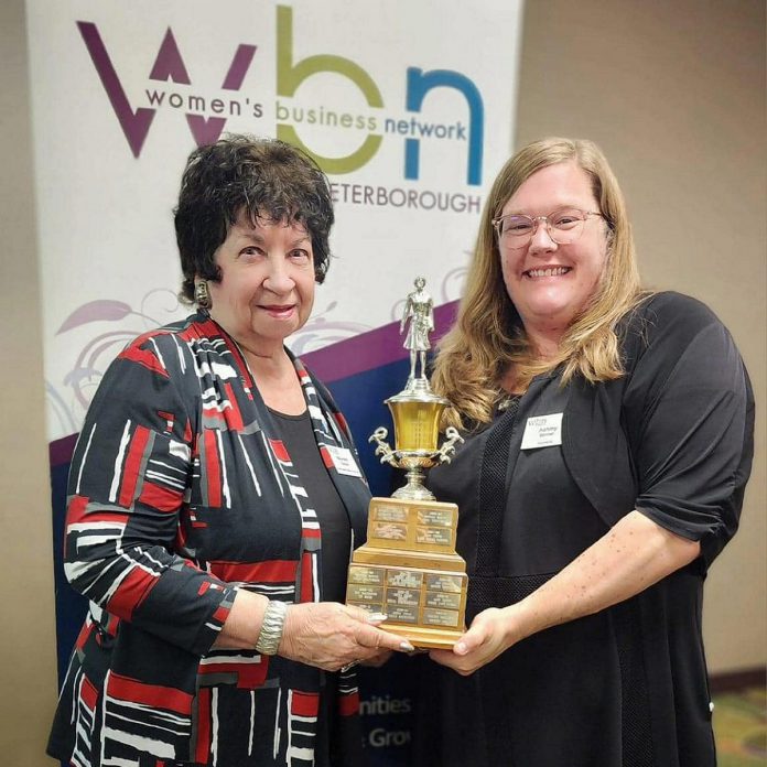 Maureen Tavener (left) awards Ashley Bonner with the 2024 Member of the Year Award from the Women's Business Network of Peterborough. Since the pandemic, the East City resident and small business owner of Smarketing has encouraged community resilience by building an online community hub, hosting neighbourhood yard sales, planning networking events, and otherwise encouraging neighbours to get to know one another. (Photo: Women's Business Network of Peterborough)