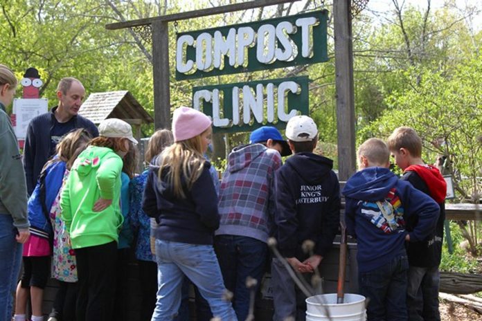 A group of children gather with educators at the former compost clinic activity centre. GreenUP is currently seeking community donations to create new hands-on activity centres and play spaces at the park. (Photo: GreenUP)
