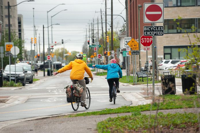 Safe routes that separate people on bikes from fast-moving traffic like Bethune Street, Peterborough's first bicycle-priority street, can convince those who are on the fence about cycling to give it a try. (Photo: Pete Rellinger)