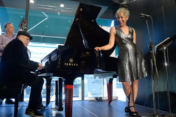 Juno award-winning Canadian jazz vocalist Molly Johnson performing with pianist Robi Botos and bassist Mike Downes at the 2019 Kensington Market Jazz Festival in 2019. Johnson will be performing with Botos and Downes along with drummer David Direnzo at Market Hall Performing Arts Centre in downtown Peterborough on April 26, 2026 as part of the annual International Jazz Day Peterborough celebrations. (Photo via Tom's Place website)