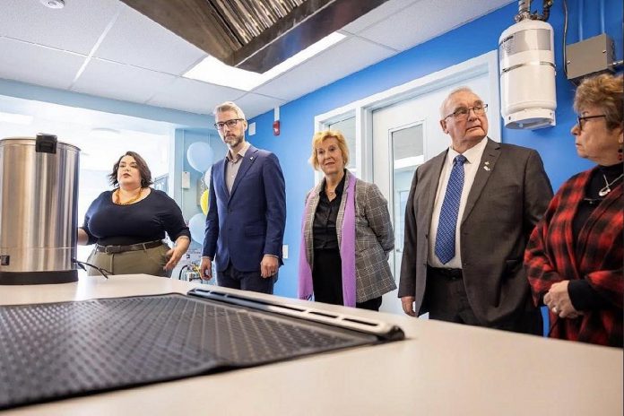 Kristal Jones-Craighead of the John Howard Society of the Kawarthas (left) takes Minister of Municipal Affairs and Housing parliamentary assistant Matthew Rae, Haliburton-Kawartha Lakes-Brock MPP Laurie Scott, Kawartha Lakes mayor Doug Elmslie, and Kawartha Lakes councillor Pat Warren on a tour of the Community Integrated Care Hub ("The Hub") at 22 Peel Street in Lindsay during a provincial funding announcement on April 7, 2026. (Photo: Office of Matthew Rae)