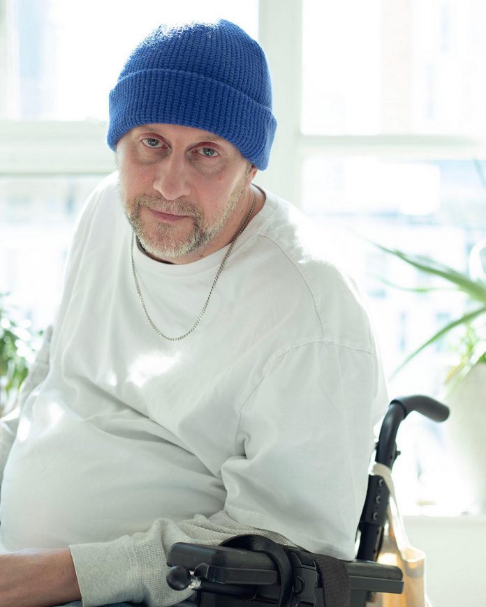 Blair "TheHandy" Williams will be the host when Disability Privilege Productions stages "Laugh Without Limits" at The Theatre on King on April 25, 2026. Believing "humour will cure everything and anything," Blair's routine includes dark humour about his experiences as a quadriplegic wheelchair user. (Photo courtesy of Disability Privilege Productions)