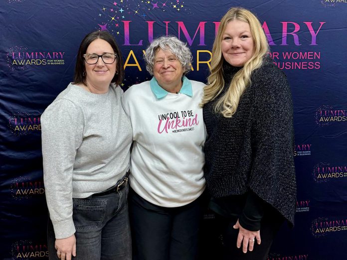 Kawartha Apparel owner Erin Shannon (right) with fellow Luminary Award nominee Lisa Couture of Candy Couture Ptbo (left) and Susan Dunkley, board chair of Peterborough and Kawarthas Chamber of Commerce, during an announcement of the 60 women nominated for the second annual Luminary Awards on February 11, 2026. An Emerging Entrepreneur nominee, Shannon credits support from the local business community as being instrumental in helping her achieve rapid growth since launching her business in 2024. (Photo: Jordan Lyall Photography)