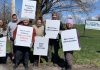 Parents and supporters at the Northview Community Campus in Peterborough, home to Northview Community Church and the Northview Daycare and Nursery School (Northview DaySchool), during an awareness event on April 19, 2026 with signs urging the church's board to reconsider the July 31 eviction deadline for Northview DaySchool and grant an extension. (Photo: Bethan Bates / kawarthaNOW)