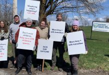 Parents and supporters at the Northview Community Campus in Peterborough, home to Northview Community Church and the Northview Daycare and Nursery School (Northview DaySchool), during an awareness event on April 19, 2026 with signs urging the church's board to reconsider the July 31 eviction deadline for Northview DaySchool and grant an extension. (Photo: Bethan Bates / kawarthaNOW)