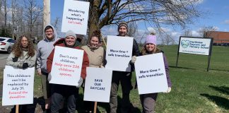 Parents and supporters at the Northview Community Campus in Peterborough, home to Northview Community Church and the Northview Daycare and Nursery School (Northview DaySchool), during an awareness event on April 19, 2026 with signs urging the church's board to reconsider the July 31 eviction deadline for Northview DaySchool and grant an extension. (Photo: Bethan Bates / kawarthaNOW)