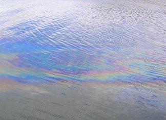 An oil slick on water. (Stock photo)