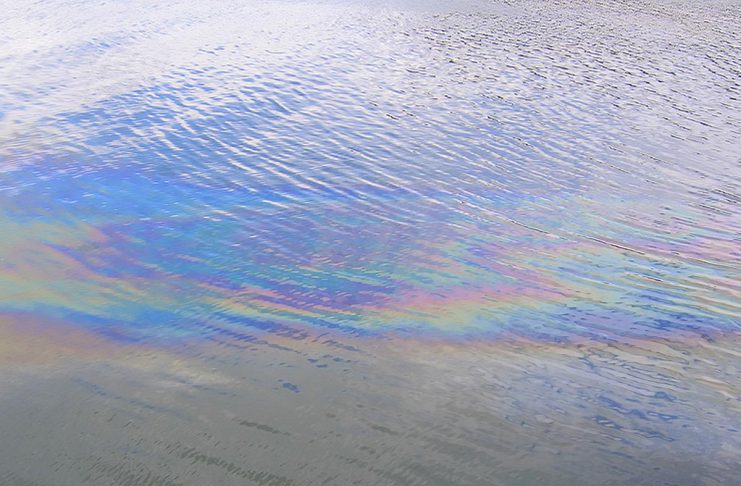 An oil slick on water. (Stock photo)