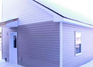 A "tiny home" built in the backyard of a residential property owned by One City Peterborough, part of a partnership with Peterborough Action for Tiny Homes (PATH) to construct additional rental units (ARUs) after PATH was unsuccessful in its efforts to obtain approvals from the City of Peterborough for temporary use by-laws to build a sleeping-cabin community for chronically unhoused people. (kawarthaNOW screenshot of One City Peterborough video)