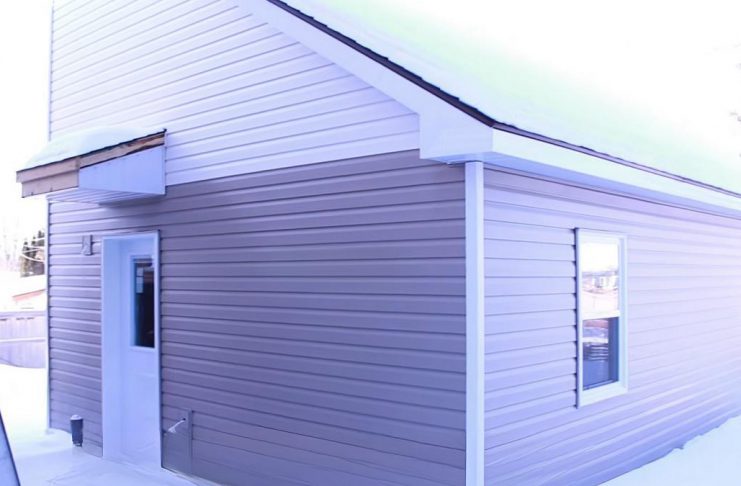 A "tiny home" built in the backyard of a residential property owned by One City Peterborough, part of a partnership with Peterborough Action for Tiny Homes (PATH) to construct additional rental units (ARUs) after PATH was unsuccessful in its efforts to obtain approvals from the City of Peterborough for temporary use by-laws to build a sleeping-cabin community for chronically unhoused people. (kawarthaNOW screenshot of One City Peterborough video)