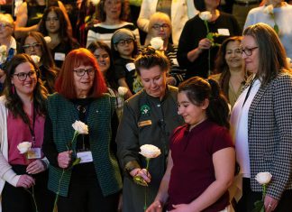 Systemic barriers facing women highlighted at event held in honour of late Peterborough civic leader Ann Farquharson Peterborough Community Health Centre executive director Ashley Safar, former YWCA Peterborough Haliburton executive director Lynn Zimmer, Senator Marilou McPhedran, Maryam Monsef's niece Ellia, and Kawartha Financial Services senior manager of commercial solutions Darlene Weales hold white roses in memory of the late Peterborough civic leader Ann Farquharson during the "A Conversation About The Status of Women In Our Community" event at Market Hall in downtown Peterborough on March 31, 2026, presented by Maryam Monsef's organization ONWARD in partnership with the Peterborough and Kawarthas Chamber of Commerce, which featured 16 female speakers engaging in conversation on important issues related to women's health, resilience, and leadership. (Photo: Jordan Lyall / kawarthaNOW)
