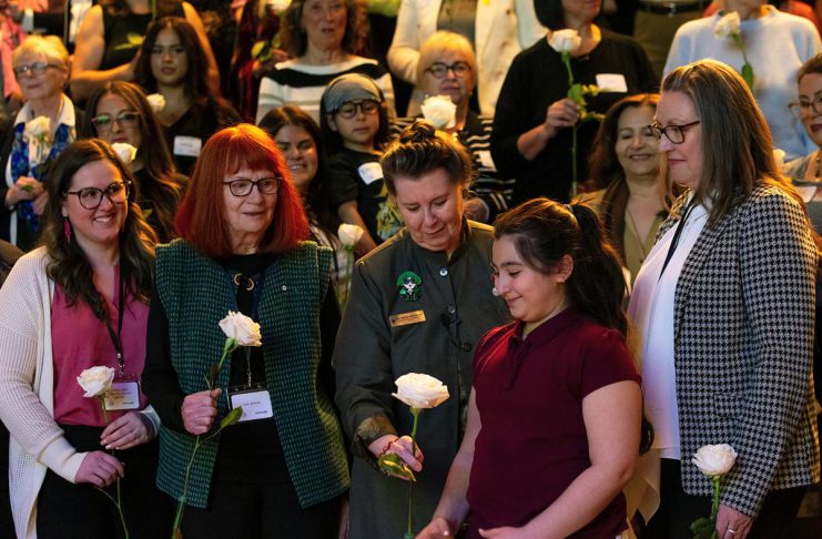 Systemic barriers facing women highlighted at event held in honour of late Peterborough civic leader Ann Farquharson Peterborough Community Health Centre executive director Ashley Safar, former YWCA Peterborough Haliburton executive director Lynn Zimmer, Senator Marilou McPhedran, Maryam Monsef's niece Ellia, and Kawartha Financial Services senior manager of commercial solutions Darlene Weales hold white roses in memory of the late Peterborough civic leader Ann Farquharson during the "A Conversation About The Status of Women In Our Community" event at Market Hall in downtown Peterborough on March 31, 2026, presented by Maryam Monsef's organization ONWARD in partnership with the Peterborough and Kawarthas Chamber of Commerce, which featured 16 female speakers engaging in conversation on important issues related to women's health, resilience, and leadership. (Photo: Jordan Lyall / kawarthaNOW)