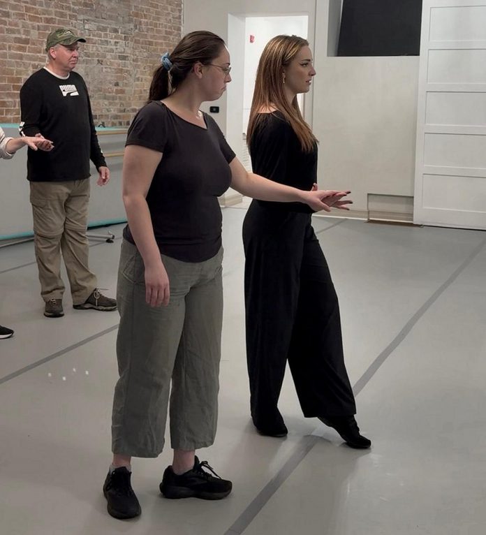 PTBO Ballroom founder Courtney Carter (right) guides a dance student. A dancer since she was five years old, Carter founded the studio to bring more opportunities for social dancing and connecting through dance to her hometown of Peterborough. She believes that rhythm and music come "naturally" and, with some structure and a supportive environment, there's a type of dance for everyone. (Photo courtesy of Courtney Carter)