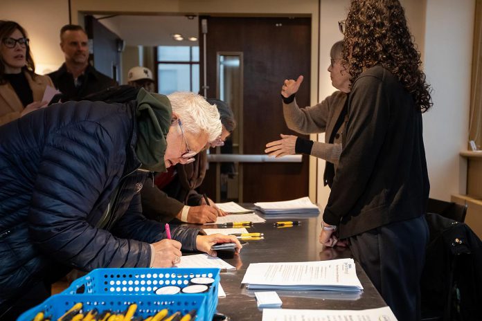 City of Peterborough Town Ward councillor Joy Lachica signs in for the "So, You Want to Run for Council - Candidate 101 Information Session" at the Market Hall Performing Arts Centre in downtown Peterborough on March 31, 2026. Lachica has announced she will be seeking re-election in Town Ward. (Photo: Jordan Lyall / kawarthaNOW)