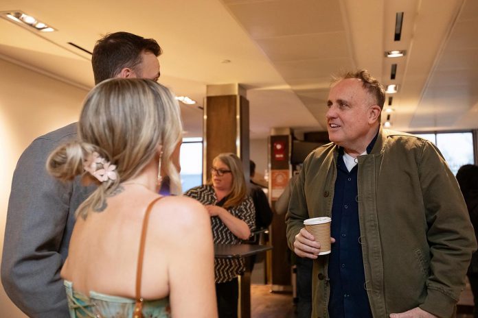 Potential mayoral candidate Neil Morton speaks with Josh Flynn and Ashley Flynn, a potential candidate for Monaghan Ward, in the lobby at Market Hall Performing Arts Centre in downtown Peterborough during the "So, You Want to Run for Council - Candidate 101 Information Session" on March 31, 2026. (Photo: Jordan Lyall / kawarthaNOW)