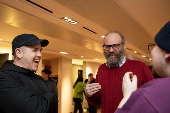 City of Peterborough Monaghan Ward councillor Matt Crowley (left) speaks with Rob Hailman and David King in the lobby at Market Hall Performing Arts Centre in downtown Peterborough during the "So, You Want to Run for Council - Candidate 101 Information Session" on March 31, 2026. (Photo: Jordan Lyall / kawarthaNOW)