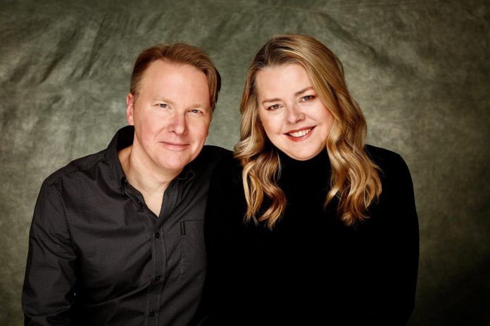 Husband-and-wife team Chris Earle and Shari Hollett and Chris Earle are the co-founders of The Night Kitchen, which they formed in 1992 with the goal of producing provocative and accessible theatre with an emphasis on satire and dark comedy. Many of the company's productions have toured widely including at fringe festivals across Canada, FringeNYC, and beyond. Their latest work, "Donnie and Me and the CBC," written and performed by Earle and directed and dramaturged by Hollett, is being staged at the Market Hall Performing Arts Centre on April 15 and 16, 2026 by Public Energy Performing Arts. (Photo courtesy of HollettEarle Learning & Creative)