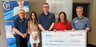 At its meeting on April 27, 2026, the Rotary Club of Peterborough presents a $12,000 cheque to Easter Seals Ontario, representing a portion of the $51,286.35 raised at the 40th annual Carl Oake Rotary Swim held on February 27. Pictured from left to right are Rotarian Ken Seim, Century 21 United owner Vanessa Oake Hogan, Baker Tilly managing partner Jeff Taylor, Easter Seals Ontario development officer Andrea Peterson, and Rotary Club of Peterborough president Tony Grady. (Photo courtesy of Rotary Club of Peterborough)