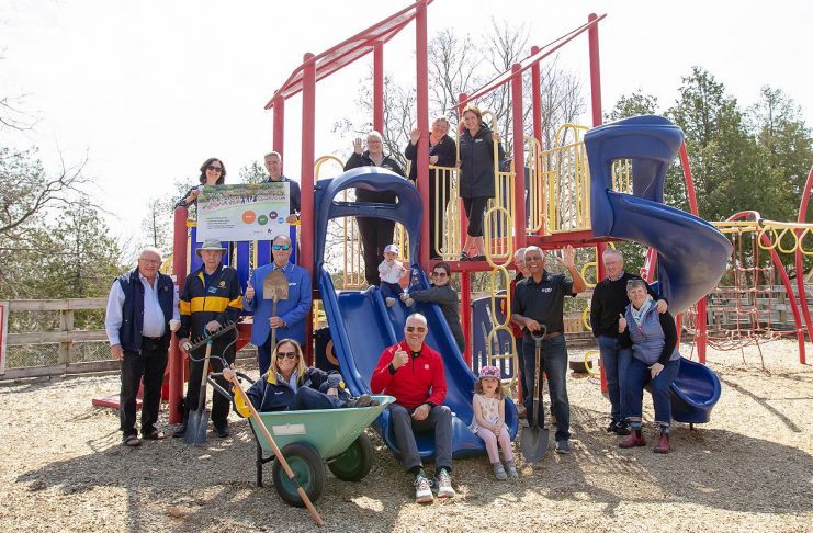The Rotary Club of Peterborough and Riverview Park and Zoo celebrated early major donors for the new Rotary Accessible Playground during an event at the zoo on April 22, 2026, and also revealed a mockup of a donor recognition wall that will be installed when the $1.5 million project is constructed. Pictured are donors at the existing play structure at the zoo. (Photo: Jordan Lyall / kawarthaNOW)