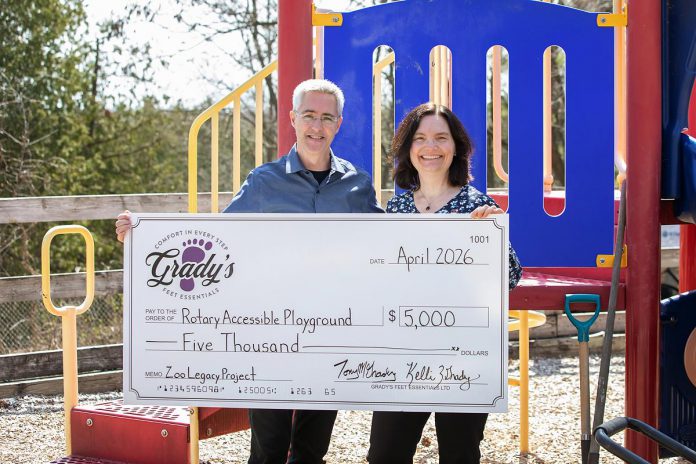 Rotarians Tony and Kelli Grady, with their donation of $5,000 for the new Rotary Accessible Playground, during an event at the Riverview Park and Zoo on April 22, 2026. (Photo: Jordan Lyall / kawarthaNOW)