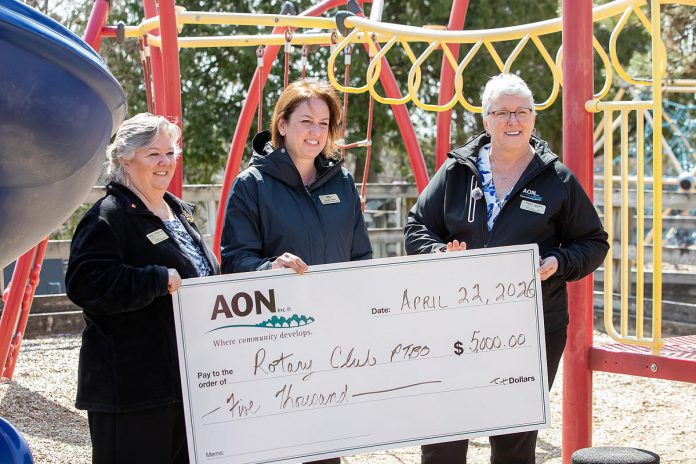 Debby Whittern, Sarah Joore, and Vicki Coppins of AON with their donation of $5,000 for the new Rotary Accessible Playground, during an event at the Riverview Park and Zoo on April 22, 2026. (Photo: Jordan Lyall / kawarthaNOW)
