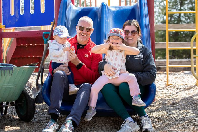 Drew Merrett of Merrett Home Hardware, who was recognized for an in-kind donation of crucial building materials for the new Rotary Accessible Playground, with his daughter and granddaughters during an event at the zoo on April 22, 2026. (Photo: Jordan Lyall / kawarthaNOW)