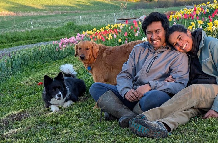 Garreth Dias and Jesvyl Dsilva with their dogs Lexie and Leo near the tulip patch on their 50-acre farm near Rice Lake south of Bailieboro. In 2021, the couple sold their Oakville condo and moved to northern Northumberland County despite not having any farming experience. Since then, Dias and Dsilva have been raising chickens and growing food on Eyra Estate and has seen a huge demand for their tulip agri-tourism experience where they invite people learn about farm life. (Photo courtesy of Garreth Dias and Jesvyl Dsilva)