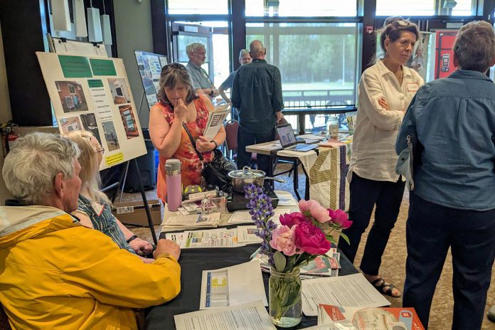 At the 2025 Home Energy and EV Expo, curious homeowners connected with others who had already embarked on an electrification journey to get their questions answered. This year's free Expo takes place Saturday, May 23 at the McDonnel Street Activity Centre from 10 a.m. to 3 p.m. and will feature local contractors and incentive program representatives sharing practical steps on how to go electric. (Photo: Clara Blakelock / GreenUP)
