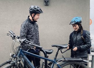 From secure bike parking to financial incentives, Peterborough businesses are creating bike-friendly workplaces While Dr. Joe Hoja (left) of Peterborough Optimetric has spent decades cycling through Peterborough, commuting by bike is a newer experience for his colleague Dr. Bella Sudik (right). Now sharing a similar ride to work, the two have bonded over their love of cycling and rarely miss a chance to swap biking tips. (Photo: Rebekkah Hyams / GreenUP)