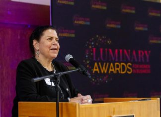 kawarthaNOW founder, CEO, and publisher Jeannine Taylor accepting the Peterborough and Kawarthas Chamber of Commerce's inaugural Legacy award of the Luminary Awards for women in business in 2025, one year before the 30th anniversary of the digital media company she founded on May 1, 1996 in the early years of the internet. (Photo: Jordan Lyall Photography)