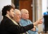 ‘The Kid from Simcoe Street’ tells the real-life story of James Clarke overcoming adversity in wartime Peterborough Retired Ontario Superior Court Justice and poet James Clarke (middle) watching a rehearsal on April 28, 2026 of Trent Valley Archives Theatre's "The Kid from Simcoe Street," based on his 2012 memoir of the same title, along with his grandson and script consultant David Francis Clarke and his old friend Murray Byrne, who he was recently reunited with after 73 years and who makes a cameo in the play, which is being staged at Market Hall Performing Arts Centre for four performances from June 4 to 7, 2026. (Photo: Jordan Lyall Photography)