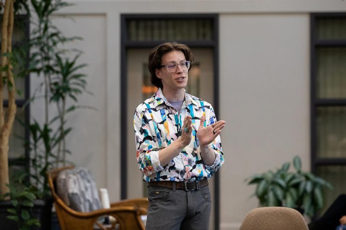 Drew Taylor-Grigg (formerly Drew Mills), director of Trent Valley Archives Theatre's "The Kid from Simcoe Street," introduces the play to the audience of a special preview dress rehearsal at Canterbury Gardens in Peterborough on May 28, 2026. (Photo: Jordan Lyall Photography)