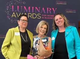 Dr. Jenny Ingram (middle) receiving the Legacy award, which honours a woman "whose career is defined by excellence, generosity, and community impact," at the Peterborough and Kawarthas Chamber of Commerce's second annual Luminary Awards celebration at Trent University's Champlain College on May 7, 2026. One of seven women who received awards, Dr. Ingram is a trailblazer in geriatric medicine and seniors' care and the founder of the Kawartha Centre, the site for international Alzheimer research trials, and recently released the documentary "No More Silent Battles." Also pictured are the inaugural Legacy award winner Jeannine Taylor of kawarthaNOW (left) and Julie Kellett of sponsor Darling Insurance. (Photo: Martha Sullivan)
