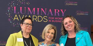 Dr. Jenny Ingram (middle) receiving the Legacy award, which honours a woman "whose career is defined by excellence, generosity, and community impact," at the Peterborough and Kawarthas Chamber of Commerce's second annual Luminary Awards celebration at Trent University's Champlain College on May 7, 2026. One of seven women who received awards, Dr. Ingram is a trailblazer in geriatric medicine and seniors' care and the founder of the Kawartha Centre, the site for international Alzheimer research trials, and recently released the documentary "No More Silent Battles." Also pictured are the inaugural Legacy award winner Jeannine Taylor of kawarthaNOW (left) and Julie Kellett of sponsor Darling Insurance. (Photo courtesy of Jeannine Taylor / kawarthaNOW)