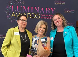 Dr. Jenny Ingram (middle) receiving the Legacy award, which honours a woman "whose career is defined by excellence, generosity, and community impact," at the Peterborough and Kawarthas Chamber of Commerce's second annual Luminary Awards celebration at Trent University's Champlain College on May 7, 2026. One of seven women who received awards, Dr. Ingram is a trailblazer in geriatric medicine and seniors' care and the founder of the Kawartha Centre, the site for international Alzheimer research trials, and recently released the documentary "No More Silent Battles." Also pictured are the inaugural Legacy award winner Jeannine Taylor of kawarthaNOW (left) and Julie Kellett of sponsor Darling Insurance. (Photo: Martha Sullivan)