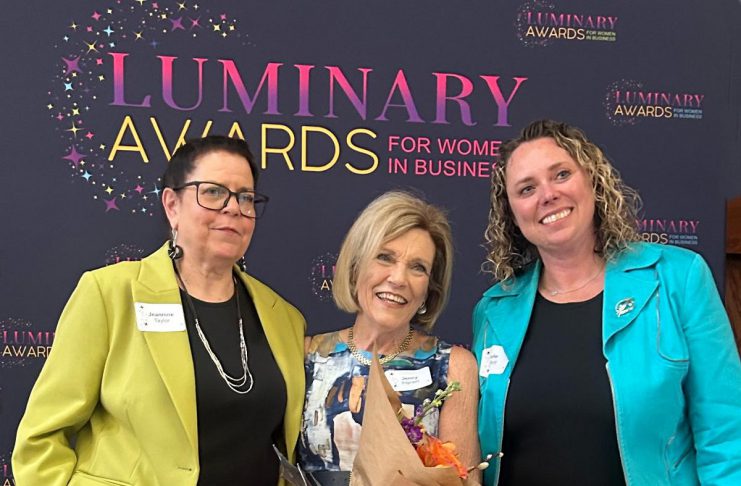 Dr. Jenny Ingram (middle) receiving the Legacy award, which honours a woman "whose career is defined by excellence, generosity, and community impact," at the Peterborough and Kawarthas Chamber of Commerce's second annual Luminary Awards celebration at Trent University's Champlain College on May 7, 2026. One of seven women who received awards, Dr. Ingram is a trailblazer in geriatric medicine and seniors' care and the founder of the Kawartha Centre, the site for international Alzheimer research trials, and recently released the documentary "No More Silent Battles." Also pictured are the inaugural Legacy award winner Jeannine Taylor of kawarthaNOW (left) and Julie Kellett of sponsor Darling Insurance. (Photo: Martha Sullivan)